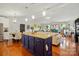 Bright, open-concept living room featuring hardwood floors, a fireplace, and lots of natural light at 6221 Thermal Rd, Charlotte, NC 28211
