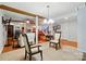 Spacious living room showcases an open floor plan with wooden accents, neutral tones and a staircase at 6221 Thermal Rd, Charlotte, NC 28211