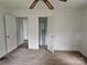 An open closet and dual doors highlight the architectural details of the bedroom at 6407 Market St, Charlotte, NC 28215