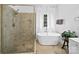Charming bathroom featuring a soaking tub, separate shower, and modern fixtures at 7006 Olde Sycamore Dr, Mint Hill, NC 28227