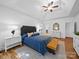 Bright bedroom with trey ceiling, sitting area, and modern furniture at 7006 Olde Sycamore Dr, Mint Hill, NC 28227