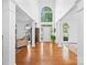Grand foyer showcasing hardwood floors, soaring ceilings, and abundant natural light at 7006 Olde Sycamore Dr, Mint Hill, NC 28227