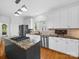 Modern kitchen featuring a granite island and stainless steel appliances at 7006 Olde Sycamore Dr, Mint Hill, NC 28227
