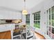 Charming breakfast nook with a glass table and bright natural light at 7006 Olde Sycamore Dr, Mint Hill, NC 28227