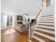 Inviting living room with fireplace, staircase, and natural light at 7006 Olde Sycamore Dr, Mint Hill, NC 28227