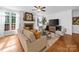 Inviting living room featuring a fireplace, ample seating, and large windows at 7006 Olde Sycamore Dr, Mint Hill, NC 28227