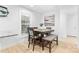 Bright dining area featuring a modern table setting, new decor, and natural light from the window at 7416 Cross Tie Ct, Mint Hill, NC 28227