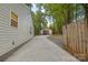 Long driveway leading to a detached garage and a fenced backyard at 7416 Cross Tie Ct, Mint Hill, NC 28227