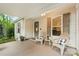 Charming front porch with seating, decorative shutters, and a welcoming entrance at 7416 Cross Tie Ct, Mint Hill, NC 28227