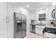 Contemporary kitchen with stainless steel appliances, sleek cabinetry, and neutral finishes at 7416 Cross Tie Ct, Mint Hill, NC 28227