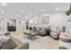 Bright living room featuring vaulted ceilings, neutral paint, contemporary decor and open concept design at 7416 Cross Tie Ct, Mint Hill, NC 28227