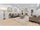 Spacious living room featuring modern furnishings, a decorative fireplace, and abundant natural light at 7416 Cross Tie Ct, Mint Hill, NC 28227