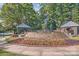 The community's entrance features beautiful landscaping and stone structures, creating a welcoming first impression at 7600 Ridgefield Dr, Charlotte, NC 28269