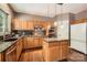 Well-equipped kitchen featuring granite countertops, stainless steel appliances, and hardwood floors at 7600 Ridgefield Dr, Charlotte, NC 28269