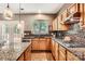 Gourmet kitchen featuring granite countertops, stainless steel appliances, and custom cabinetry at 7600 Ridgefield Dr, Charlotte, NC 28269