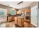 Functional kitchen showcasing stainless steel appliances, hardwood floors, and plenty of natural light at 7600 Ridgefield Dr, Charlotte, NC 28269