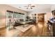 Inviting living room with hardwood floors, comfortable seating, and easy access to the kitchen at 7600 Ridgefield Dr, Charlotte, NC 28269