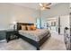 Spacious main bedroom featuring an ensuite bathroom with double doors and a ceiling fan at 7600 Ridgefield Dr, Charlotte, NC 28269