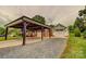 A view of the backyard featuring a carport and detached garage at 800 Sunset Rd, Cherryville, NC 28021