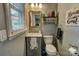 The bathroom features a mirror, toilet, and sink, combining functionality with essential fixtures at 800 Sunset Rd, Cherryville, NC 28021