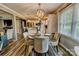 Cozy dining area with a round table, stylish chairs, and views into the kitchen at 800 Sunset Rd, Cherryville, NC 28021