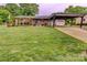 Beautiful brick home with well-manicured lawn, carport, and a charming blue front door at 800 Sunset Rd, Cherryville, NC 28021