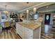 Open concept kitchen with granite countertops, stainless steel appliances, and view to living room and dining area at 800 Sunset Rd, Cherryville, NC 28021