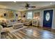 Comfortable living room with stylish decor, wood floors, and a vibrant blue front door at 800 Sunset Rd, Cherryville, NC 28021