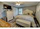 This main bedroom features a ceiling fan and dresser, providing ample space for relaxation and storage at 800 Sunset Rd, Cherryville, NC 28021