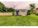 A charming shed in the backyard with a blue door at 800 Sunset Rd, Cherryville, NC 28021
