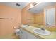 Bathroom featuring double vanity, white cabinets, and tile shower/tub combo at 8017 Prince George Rd, Charlotte, NC 28210