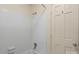 Bright bathroom with a tiled shower, white walls, and a new shower head at 8017 Prince George Rd, Charlotte, NC 28210
