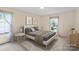 Serene bedroom featuring a comfortable bed, soft lighting, and decorative curtains for a tranquil space at 8017 Prince George Rd, Charlotte, NC 28210