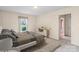 Bright bedroom with a plush bed, soft neutral tones, and ample natural light from the window at 8017 Prince George Rd, Charlotte, NC 28210