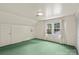 Bedroom featuring green carpet, bright walls and a window at 8017 Prince George Rd, Charlotte, NC 28210