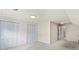 Bedroom with closet and entryway showcasing clean, neutral-colored walls at 8017 Prince George Rd, Charlotte, NC 28210