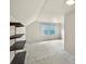 Bright bedroom featuring built-in shelving, double window, and neutral carpet at 8017 Prince George Rd, Charlotte, NC 28210