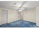 Bedroom featuring blue carpet, bright walls and a ceiling fan at 8017 Prince George Rd, Charlotte, NC 28210