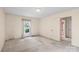 Bright bedroom with neutral walls, carpet floors, and a sunny window at 8017 Prince George Rd, Charlotte, NC 28210