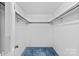 Walk-in closet featuring shelving and neutral-colored walls at 8017 Prince George Rd, Charlotte, NC 28210