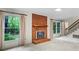 The living room has a fireplace and stairs leading to the second floor at 8017 Prince George Rd, Charlotte, NC 28210
