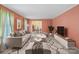 Bright living room with a neutral sofa, modern rug, and open access to the dining area at 8017 Prince George Rd, Charlotte, NC 28210