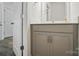 Clean bathroom featuring a gray vanity with brushed nickel hardware and modern fixtures at 8018 Saluda Dr, Charlotte, NC 28269