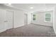 Bright bedroom with tray ceiling, recessed lights and large windows at 8018 Saluda Dr, Charlotte, NC 28269
