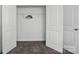 Empty closet with gray carpeting, white walls, one shelf, and three hangers at 8018 Saluda Dr, Charlotte, NC 28269