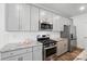 Modern kitchen with stainless steel appliances, granite countertops, and white subway tile backsplash at 8018 Saluda Dr, Charlotte, NC 28269