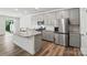 Modern kitchen features stainless steel appliances, granite countertops, and ample cabinet space at 8018 Saluda Dr, Charlotte, NC 28269