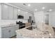 Well-equipped kitchen featuring stainless steel appliances, granite counters, and grey cabinets at 8018 Saluda Dr, Charlotte, NC 28269
