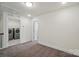Comfortable bedroom with access to a laundry room at 8018 Saluda Dr, Charlotte, NC 28269