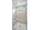 Modern tiled shower with glass door and built-in bench at 8018 Saluda Dr, Charlotte, NC 28269